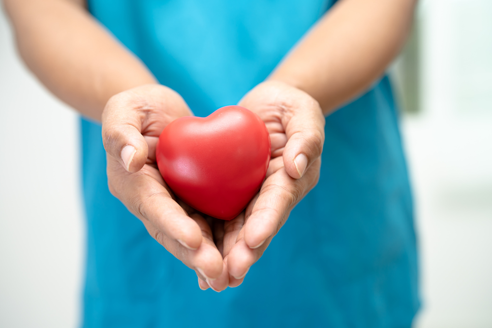 woman with heart in hand