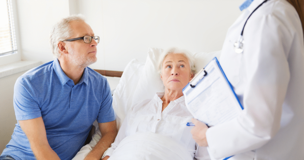 discharge nurse talking to patient and husband
