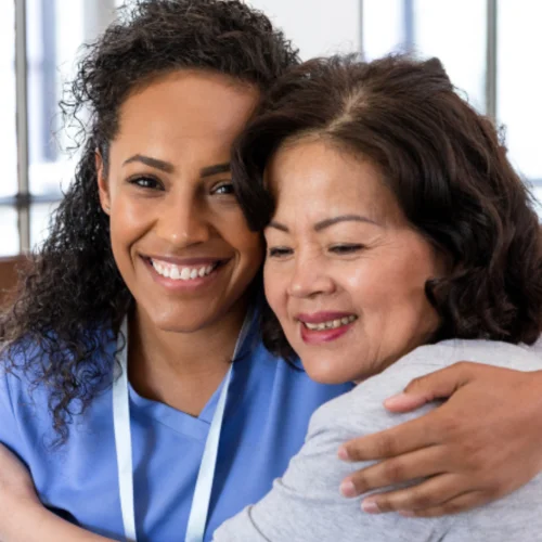 caregiver hugging patient
